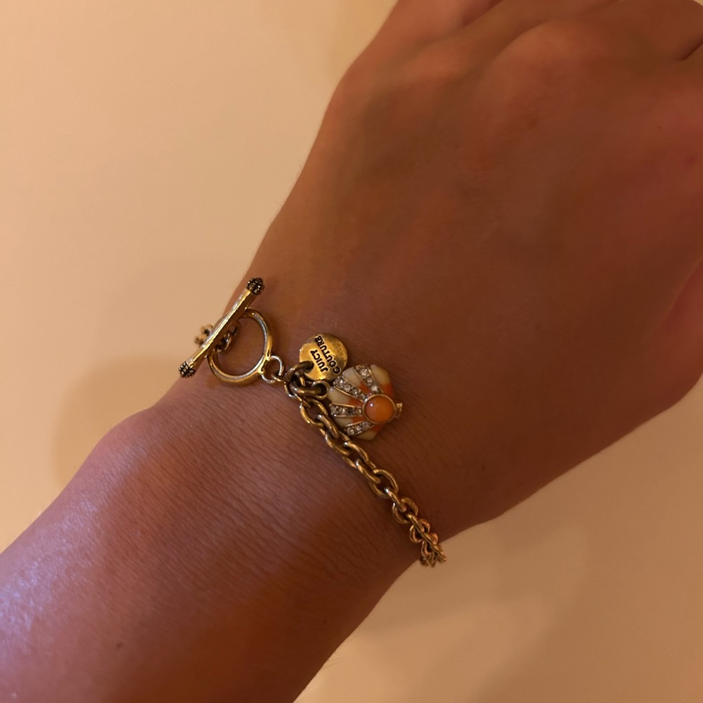 Juicy Couture Gold Charm Bracelet with Orange Shell Accents